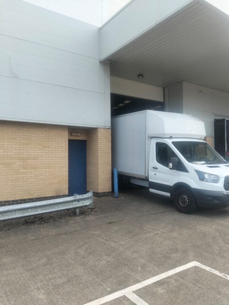 Papa Professional Removals Luton van at a commercial loading bay