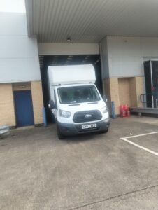 Papa Professional Removals Luton van at a commercial loading bay